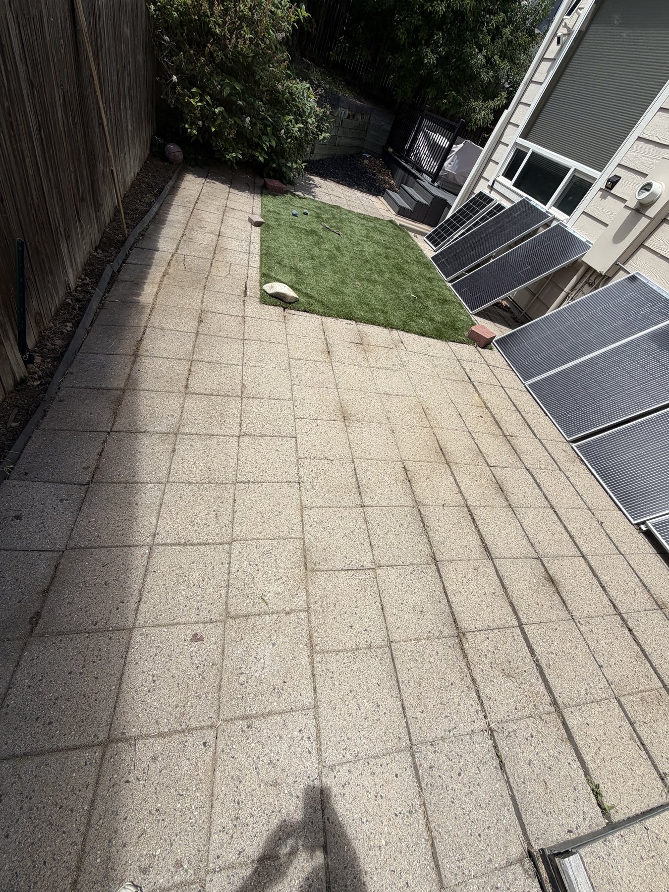 After: cleared and weeded stone patio walkway